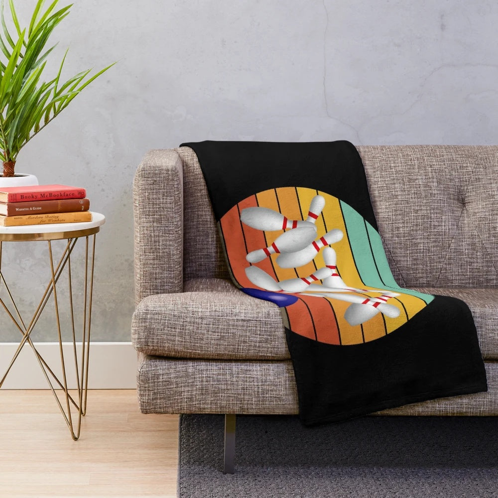 Soft and cozy plush blanket featuring a bowling strike design