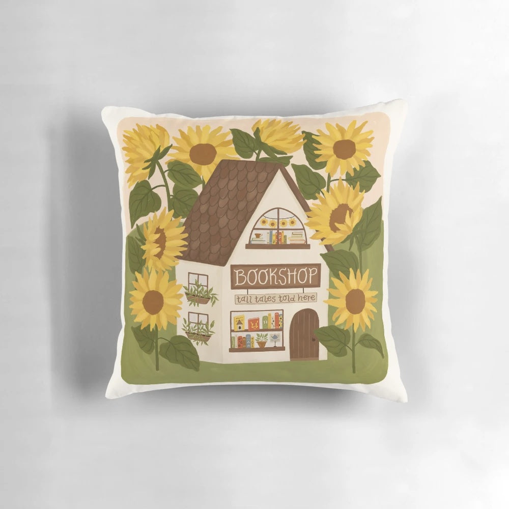 Sunflower-patterned pillow with a vintage bookshop aesthetic
