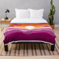 Soft and snug plush blanket with a subtle LGBTQ sunset flag design