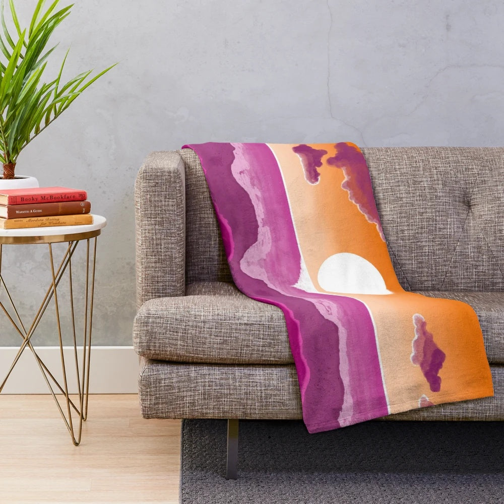 Soft and snug plush blanket with a subtle LGBTQ sunset flag design