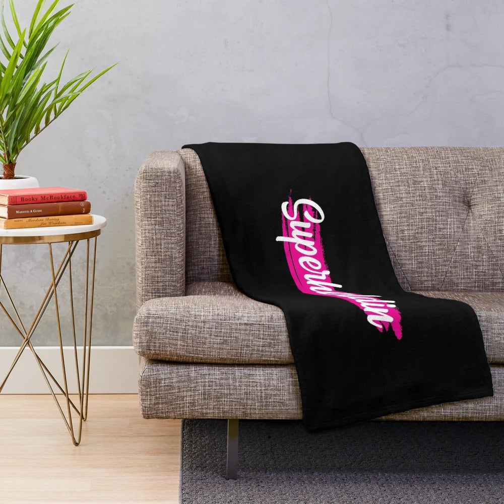 Plush superhero blanket featuring a powerful female heroine