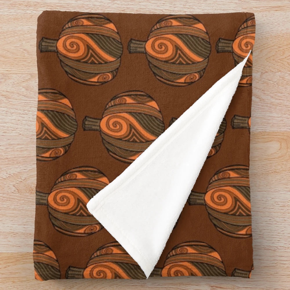 Artsy pumpkin-patterned plush blanket with swirl design