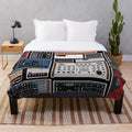 Plush blanket featuring synthesizer and electronic music-inspired design