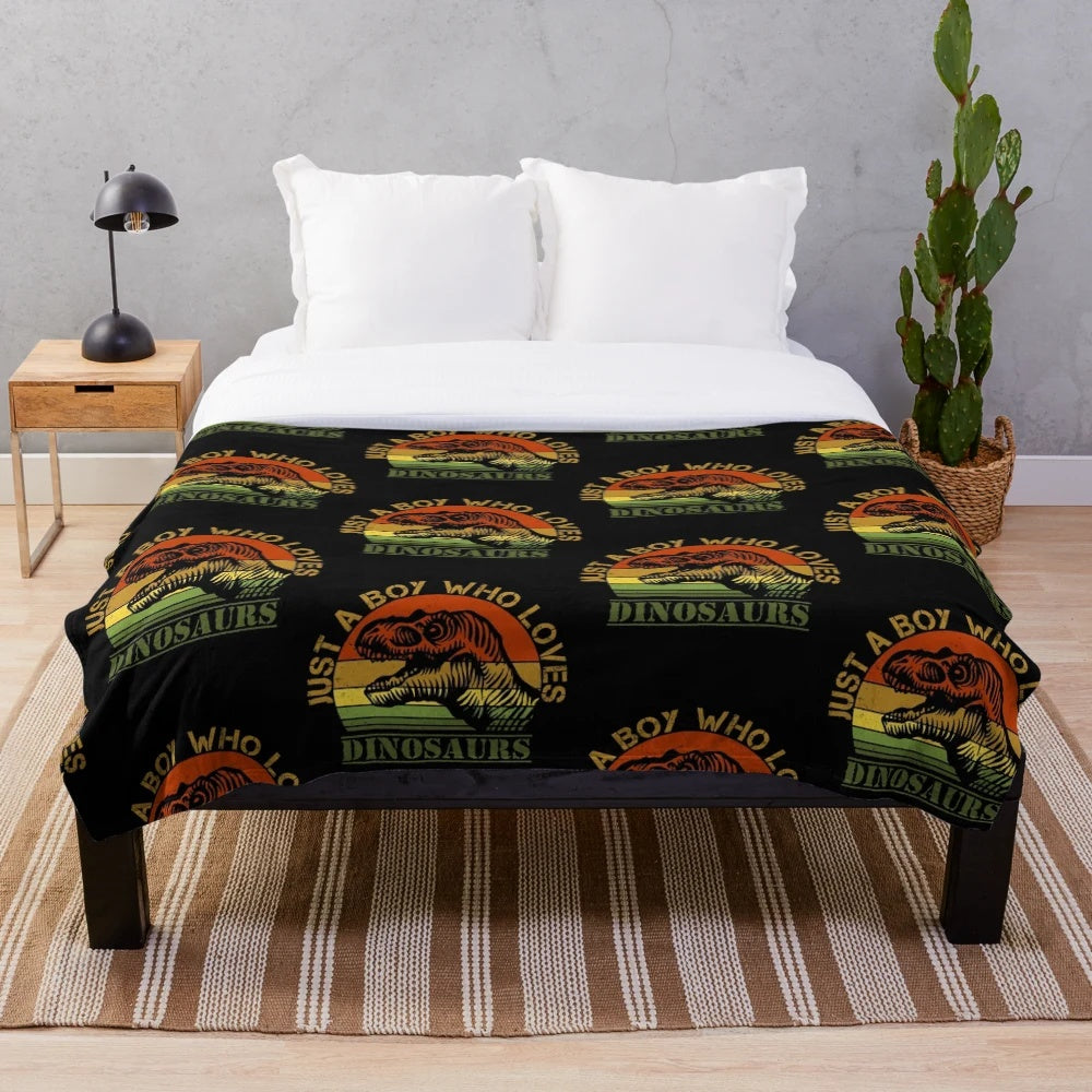 T-Rex plush blanket with "Just a boy who loves dinosaurs" design