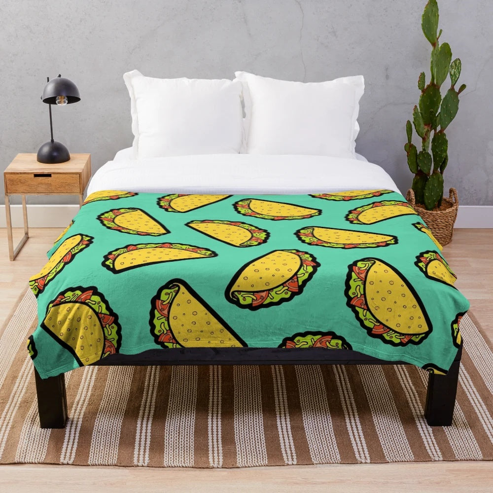 Colorful taco-themed plush blanket with a fun, hand-drawn pattern