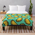 Colorful taco-themed plush blanket with a fun, hand-drawn pattern