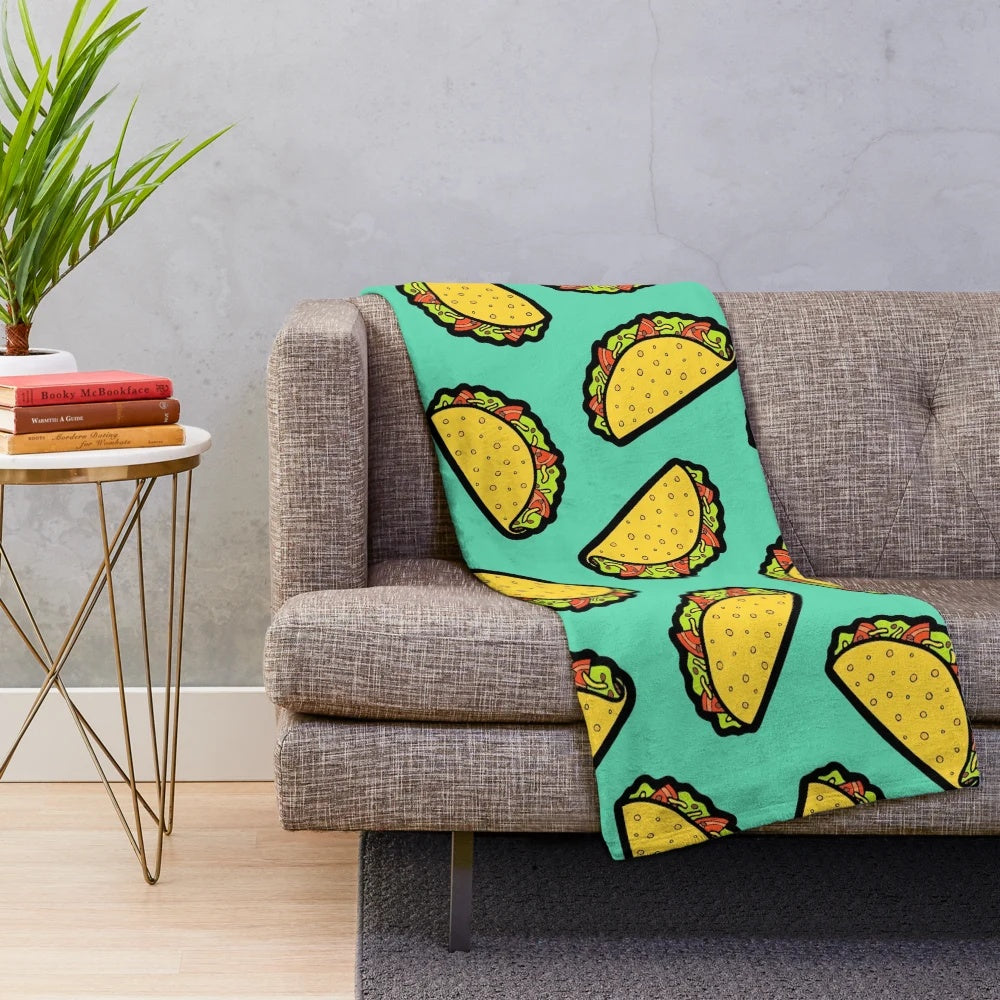 Colorful taco-themed plush blanket with a fun, hand-drawn pattern