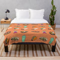 Taco-themed plush blanket with cute doodle design