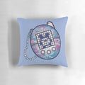 Plush tamagotchi-themed pillow in a retro, kawaii aesthetic