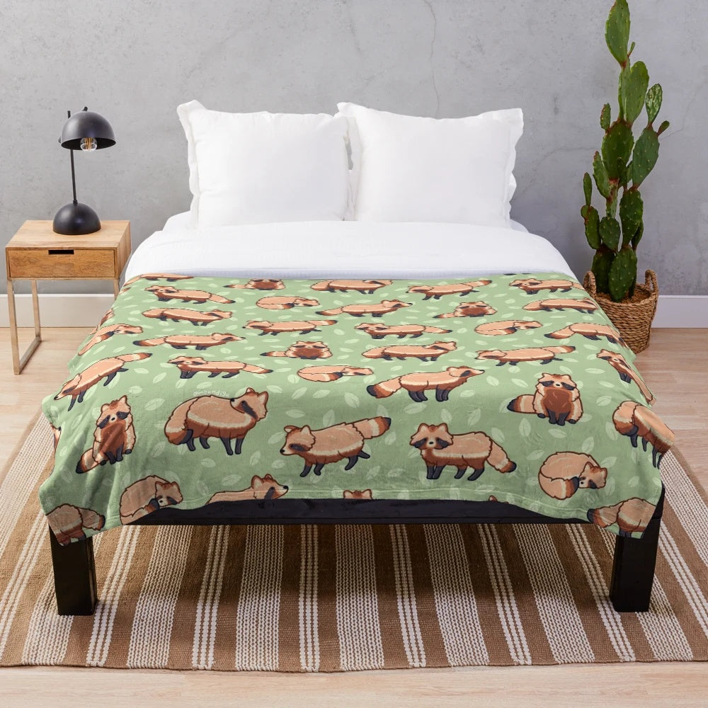 Tanuki patterned plush blanket with a cute cartoon raccoon dog design