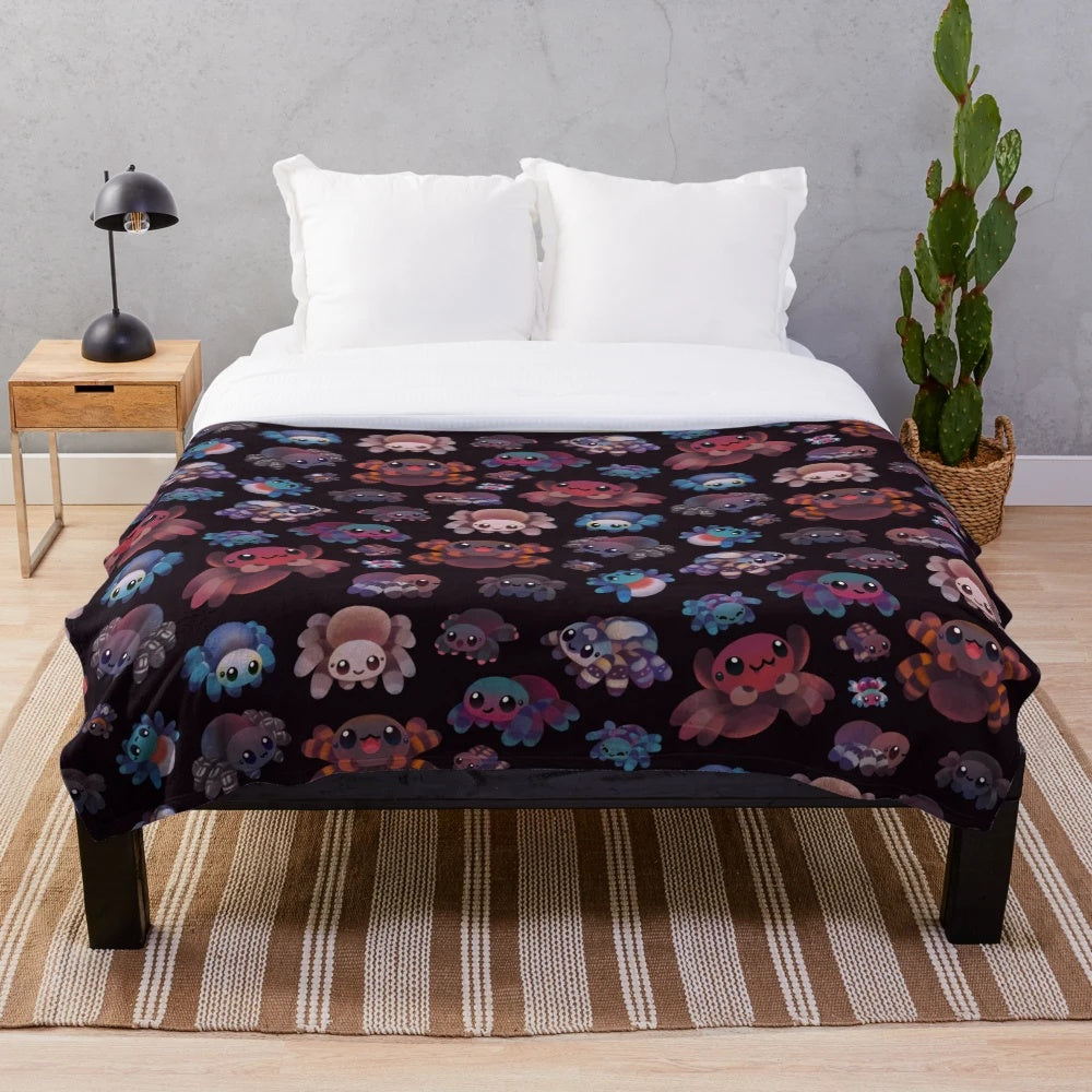 Dark plush blanket featuring a tarantula design
