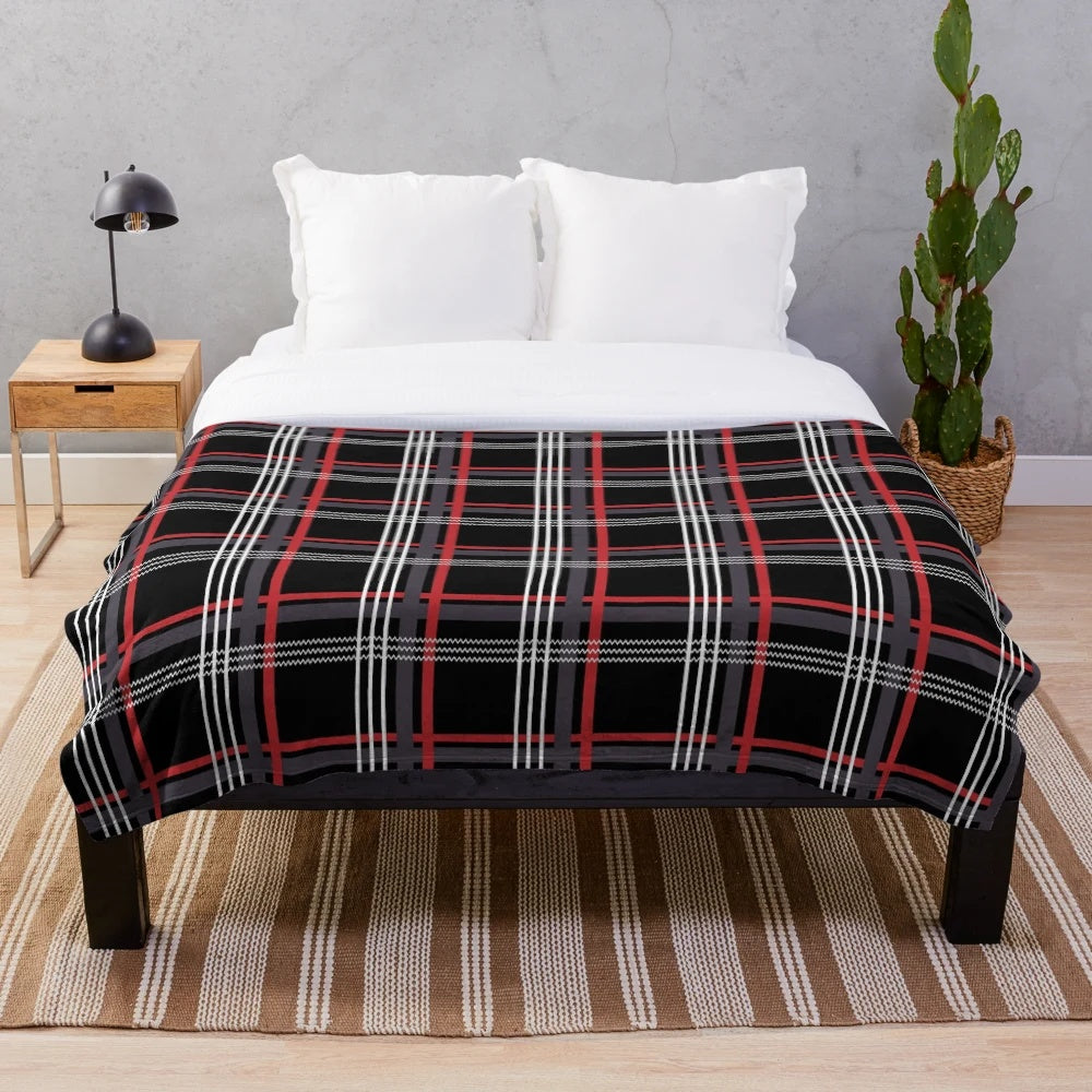 Tartan plush blanket in black, red, white, and grey colors