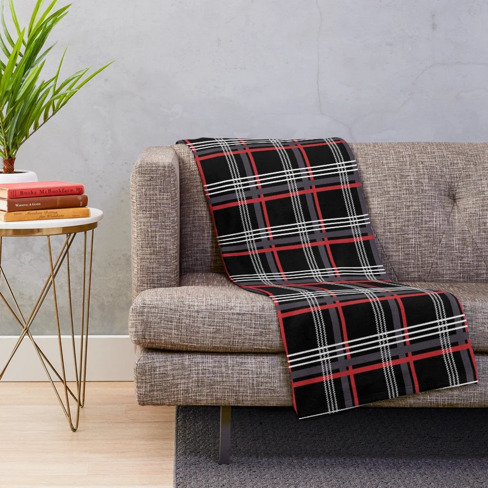 Tartan plush blanket in black, red, white, and grey colors