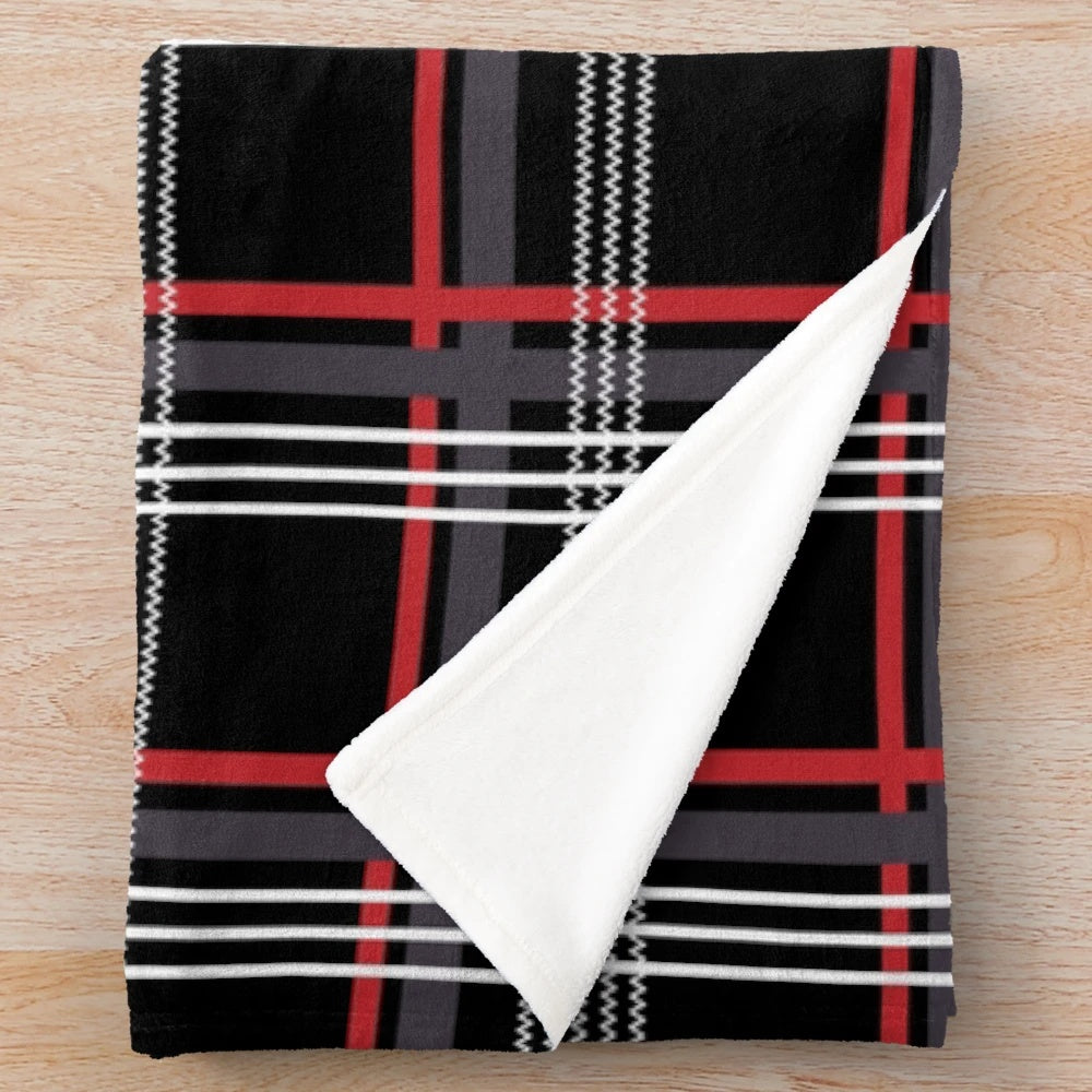 Tartan plush blanket in black, red, white, and grey colors