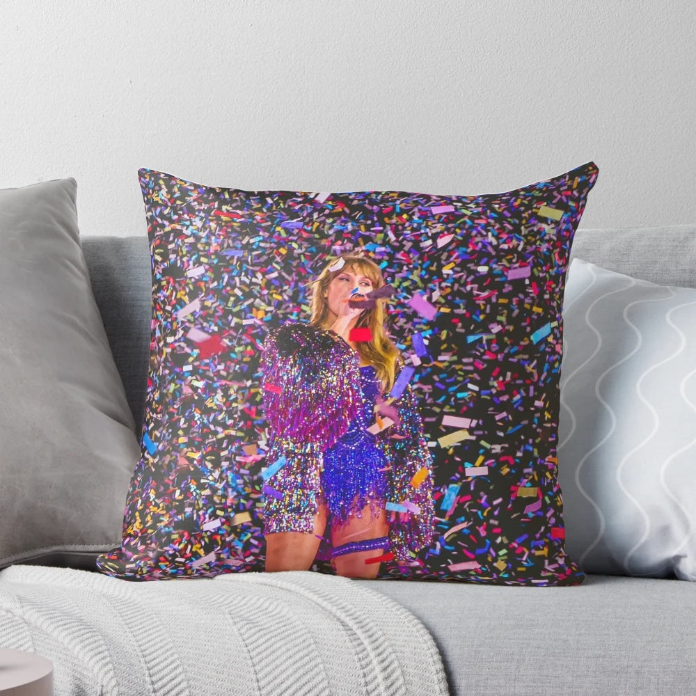 A soft, plush pillow featuring a colorful confetti design inspired by Taylor Swift's "Eras Tour