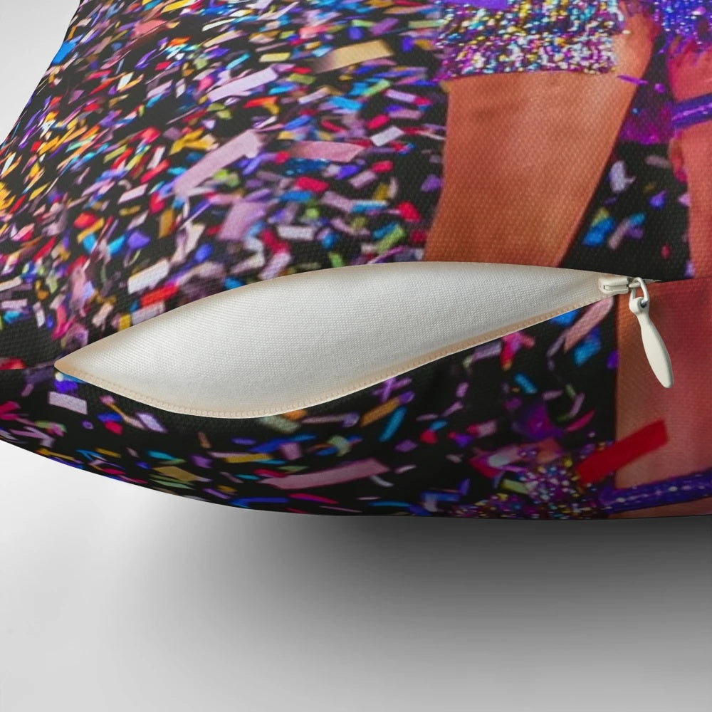 A soft, plush pillow featuring a colorful confetti design inspired by Taylor Swift's "Eras Tour