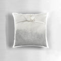 A plush tea bag-shaped pillow with a soothing, natural design
