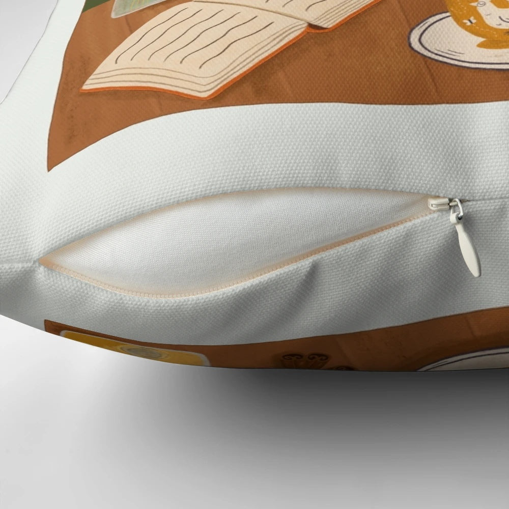 A cozy tea time pillow featuring a teapot, teacup, and books on a cottage-style windowsill.