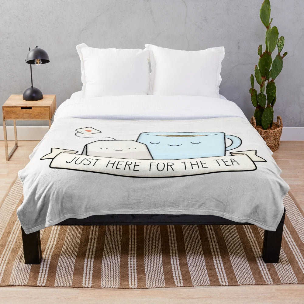 Cozy plush tea themed blanket with teacups and pun design