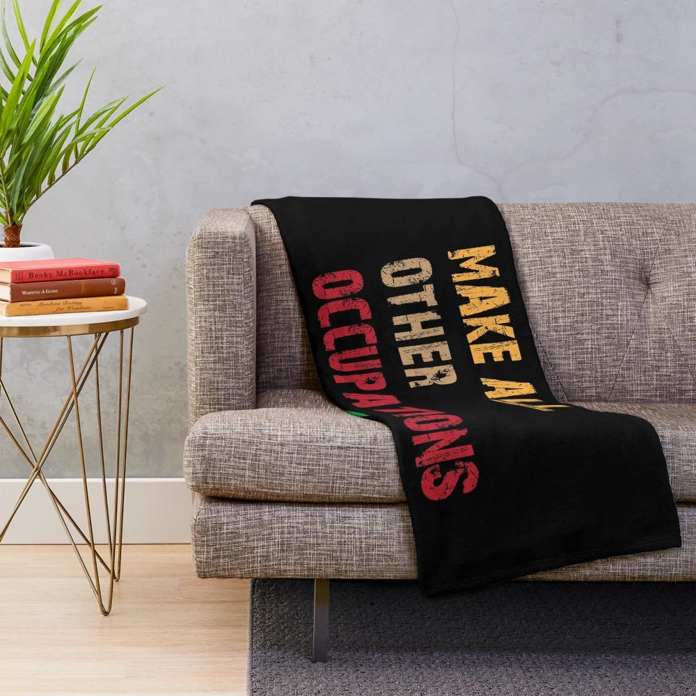 Plush blanket with a quote about teachers making other occupations possible