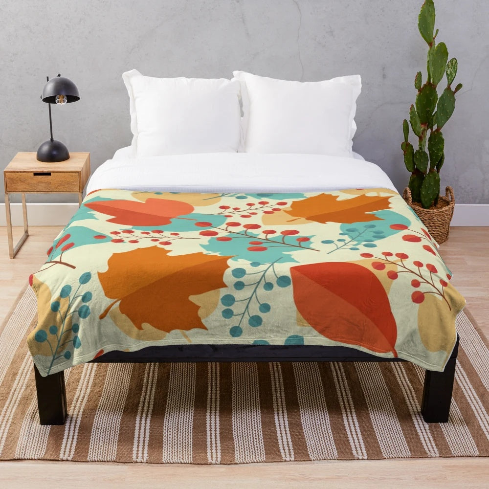 Teal and orange plush blanket with fall foliage design