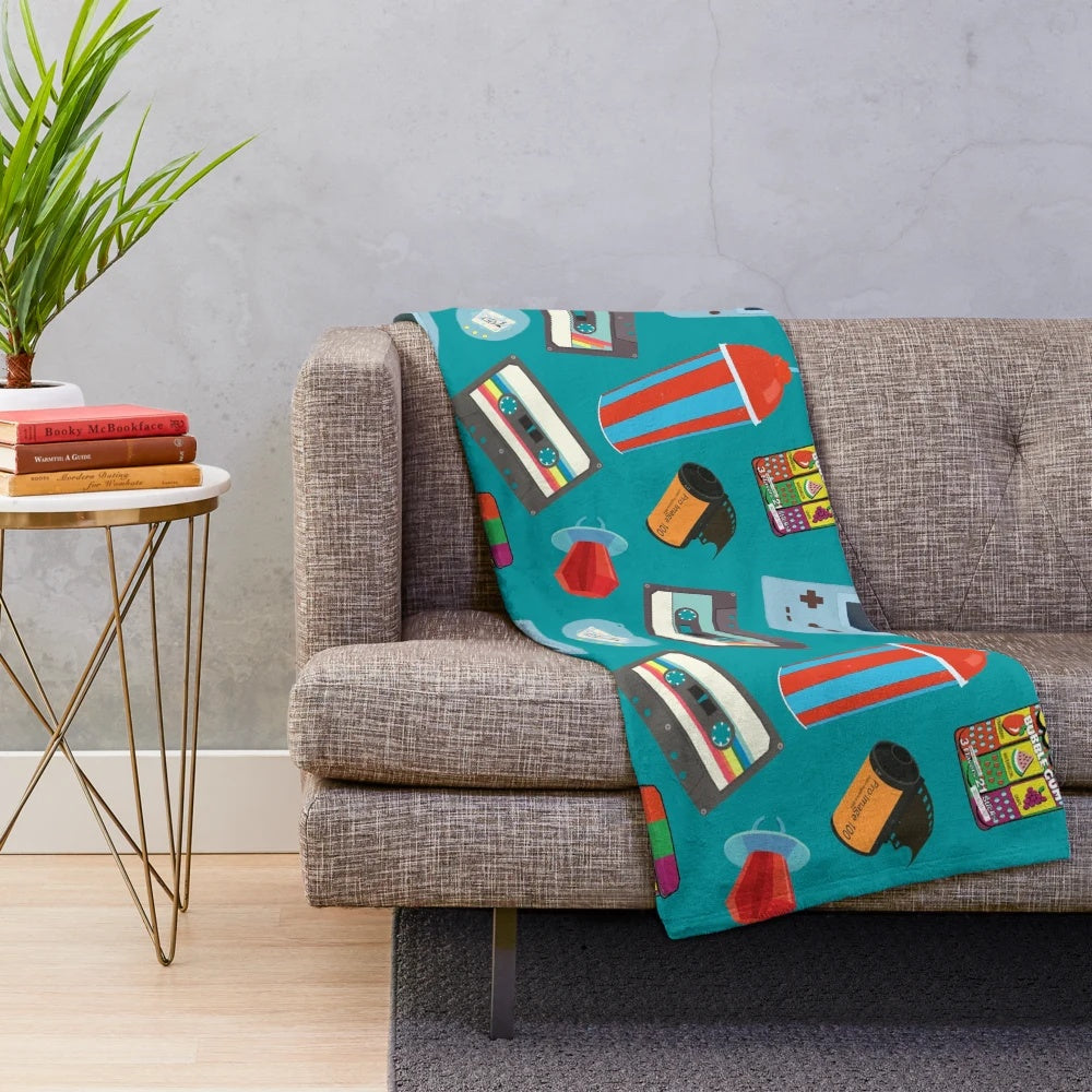 Teal plush blanket with nostalgic retro patterns