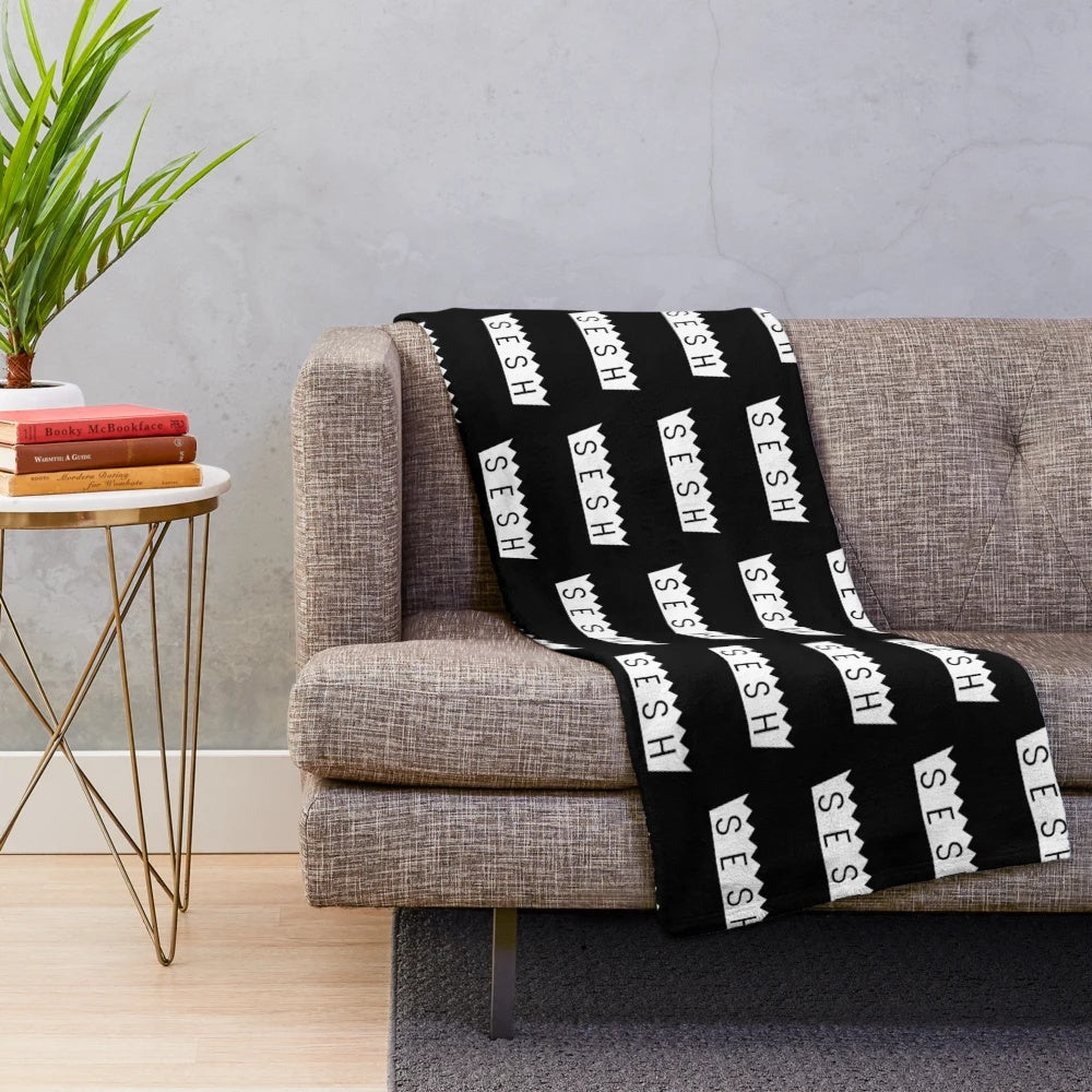 Team SESH plush blanket with bones and sesh design
