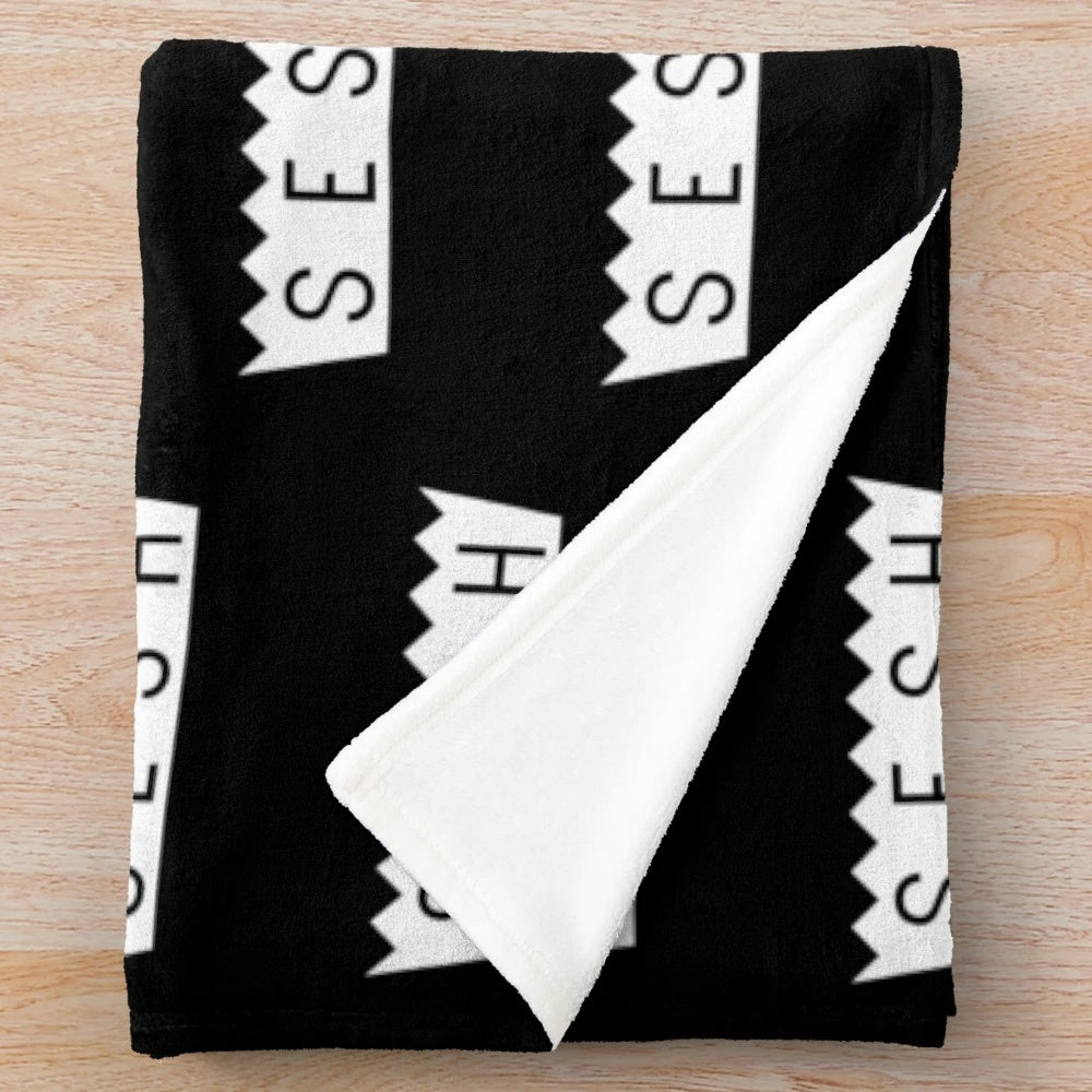 Team SESH plush blanket with bones and sesh design