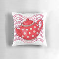 A cozy and charming teatime-themed pillow featuring a red teapot and floral design.