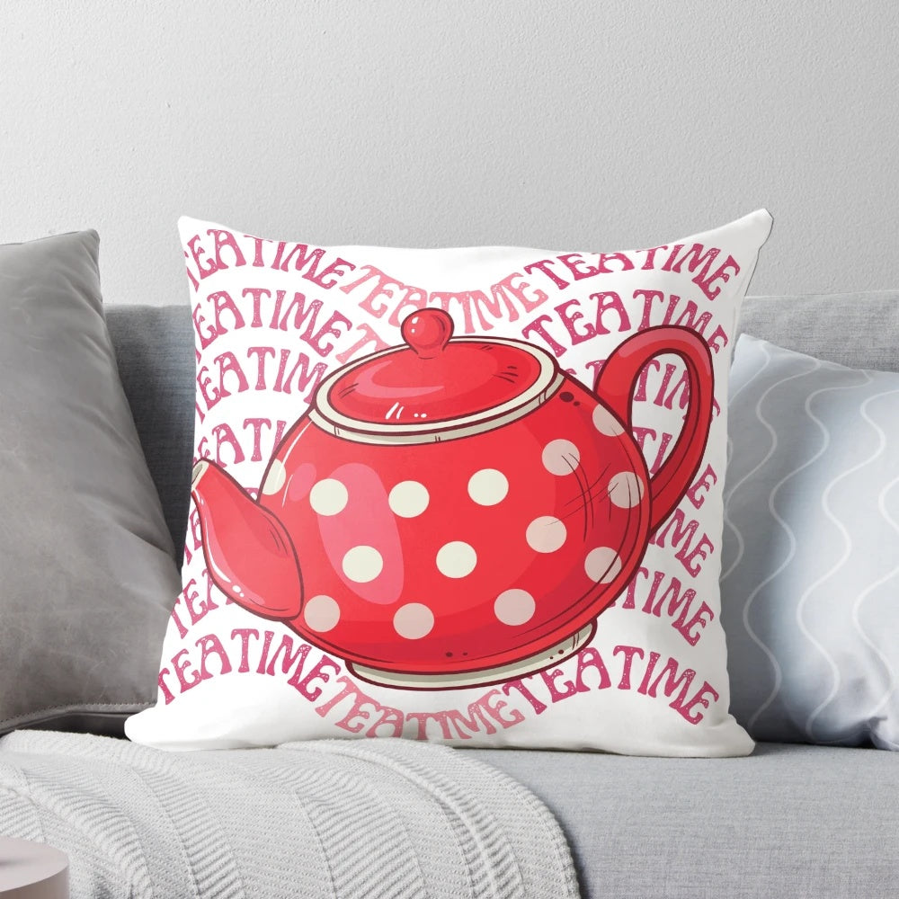 A cozy and charming teatime-themed pillow featuring a red teapot and floral design.