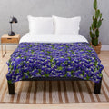 Plush blanket with vibrant bluebonnet floral design