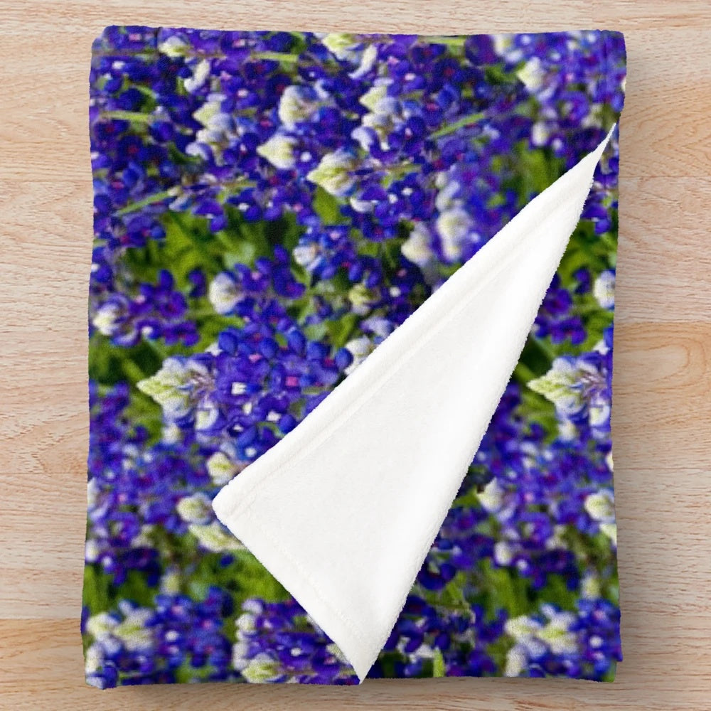 Plush blanket with vibrant bluebonnet floral design