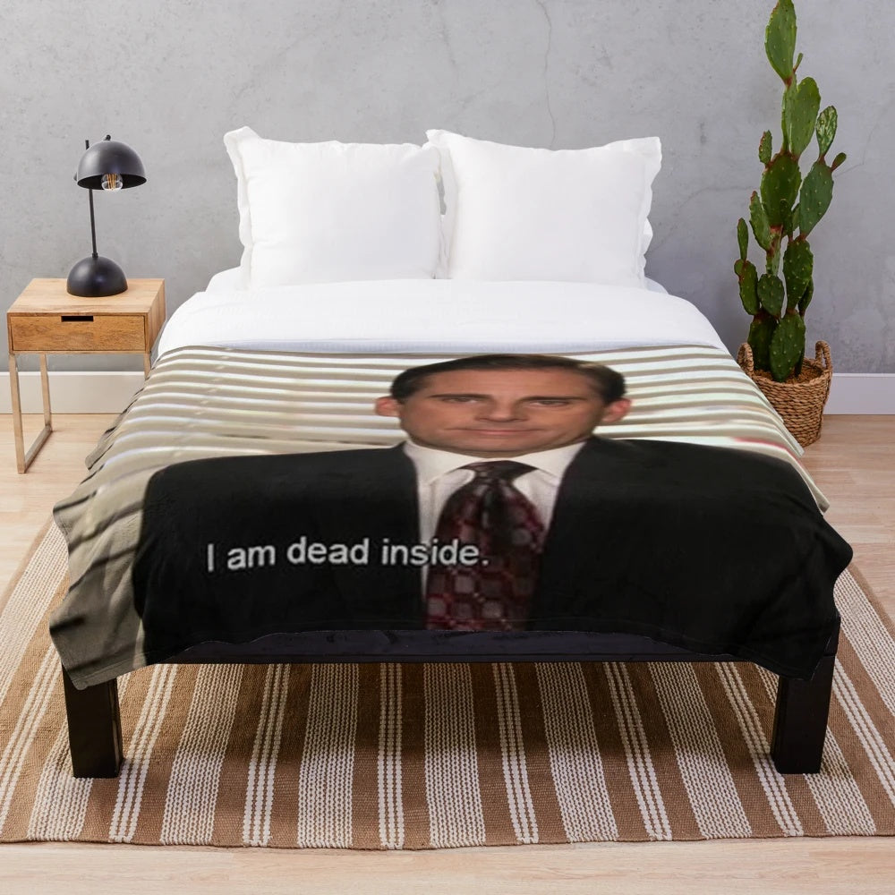 The Office inspired plush blanket featuring Michael Scott and Dunder Mifflin logo