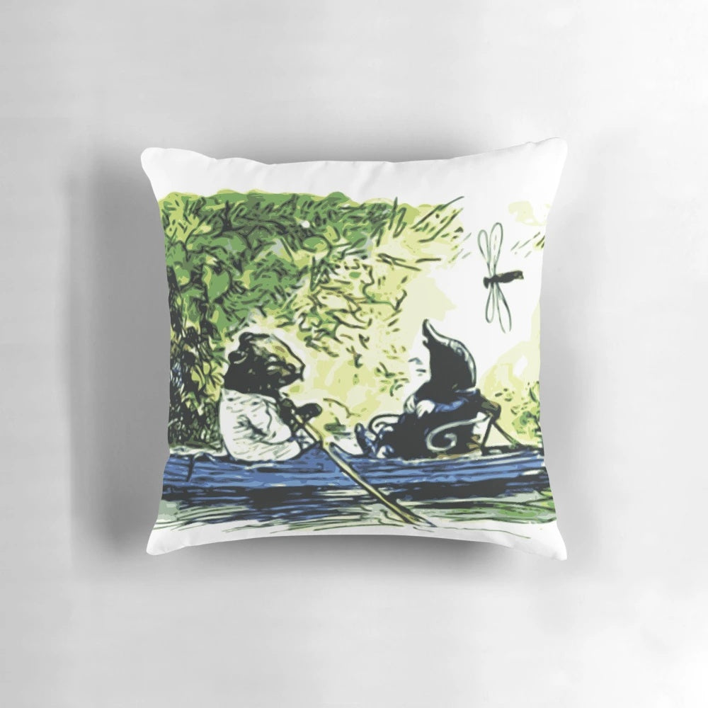 A decorative pillow featuring a quote from "The Wind in the Willows" by Kenneth Grahame, with an illustration of boats.