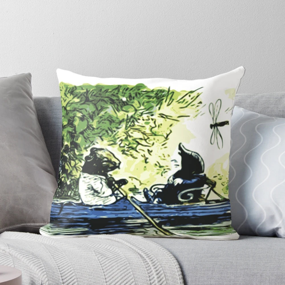 A decorative pillow featuring a quote from "The Wind in the Willows" by Kenneth Grahame, with an illustration of boats.