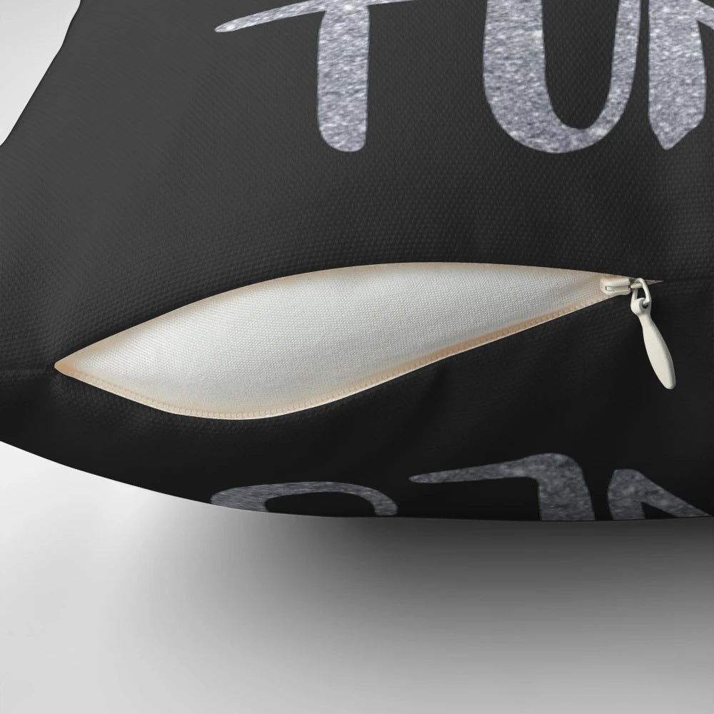 A plush pillow featuring the text "I Speak Fluent Showtunes" against a theatre-inspired background.