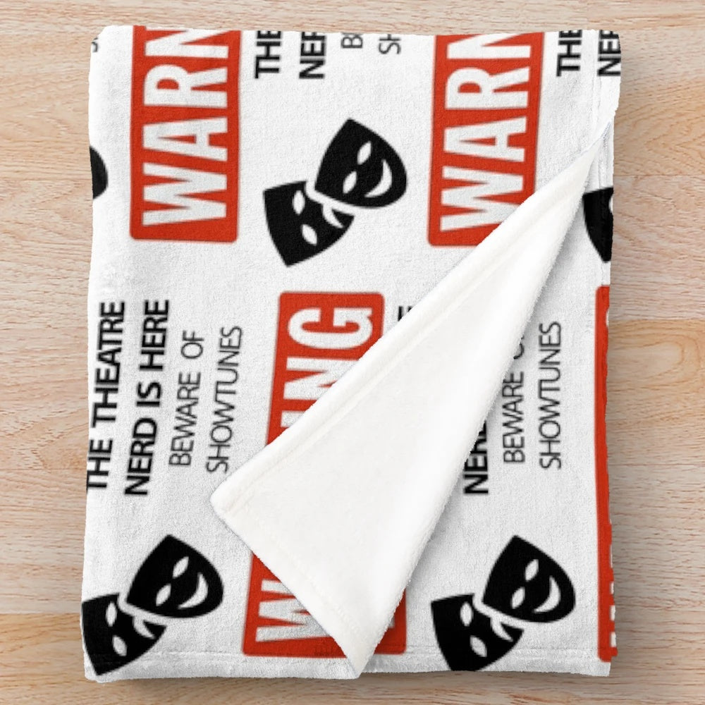 Plush theatre nerd blanket featuring show-themed designs for musical lovers