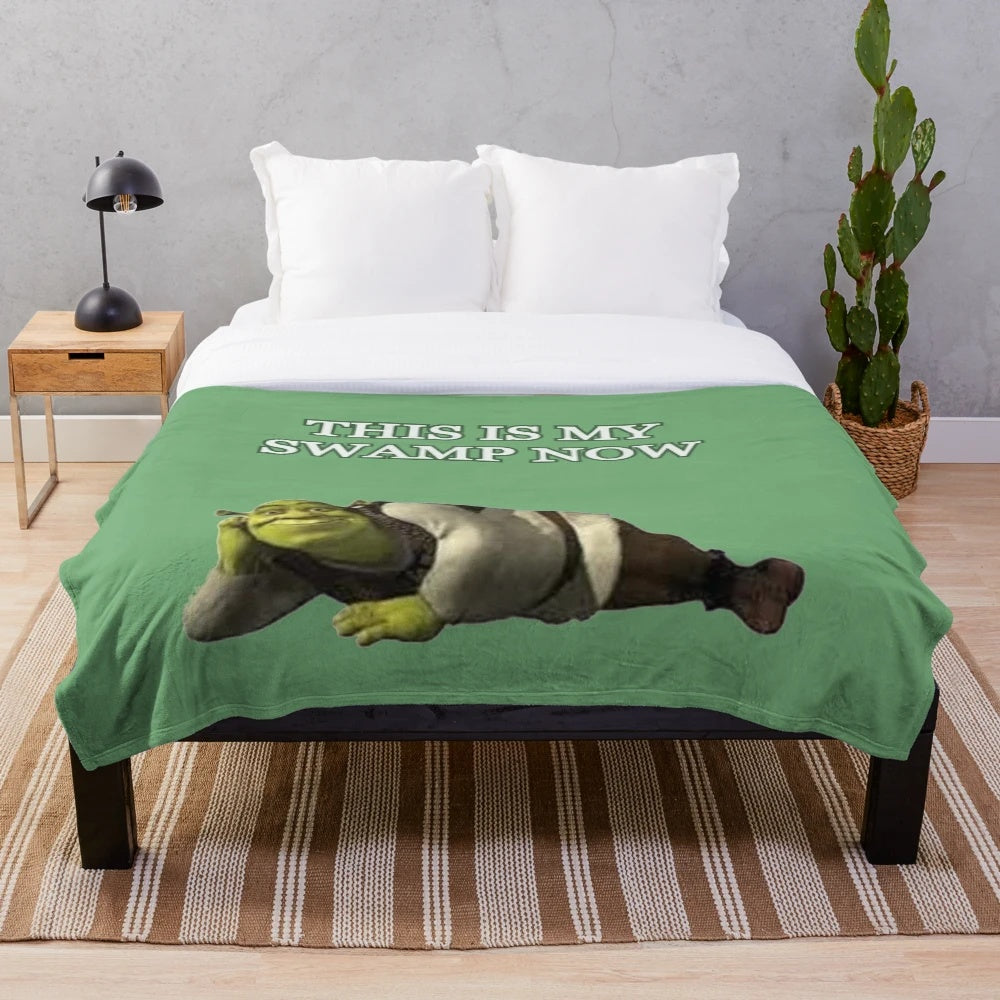 Plush blanket with a "This Is My Swamp Now" inspired design featuring a green, cartoon-like swamp scene