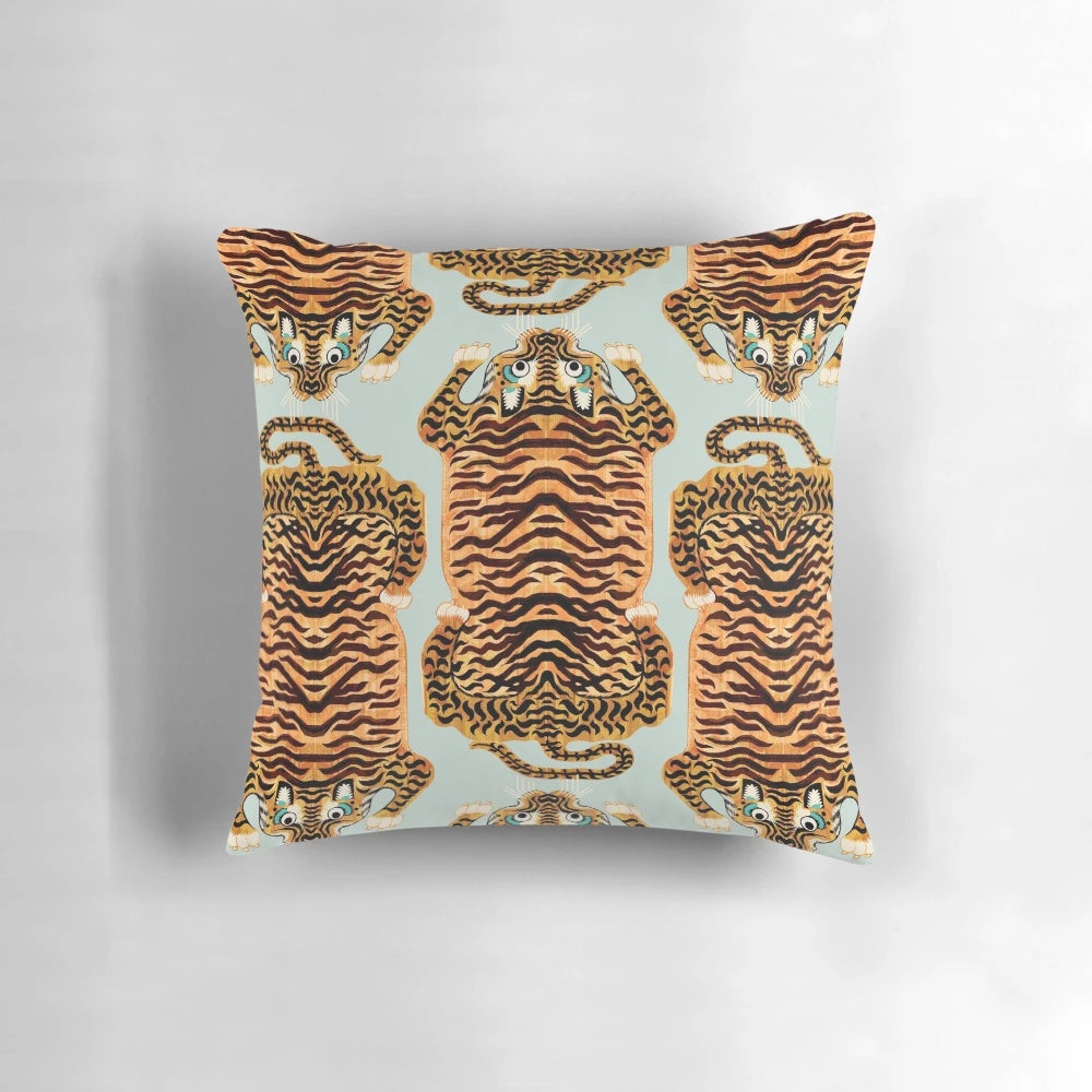 Soft, plush tiger rug pillow in sage green and gold tones, featuring a Tibetan-inspired design with realistic tiger stripes.