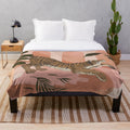 Plush tiger-inspired blanket with modern tropical foliage design