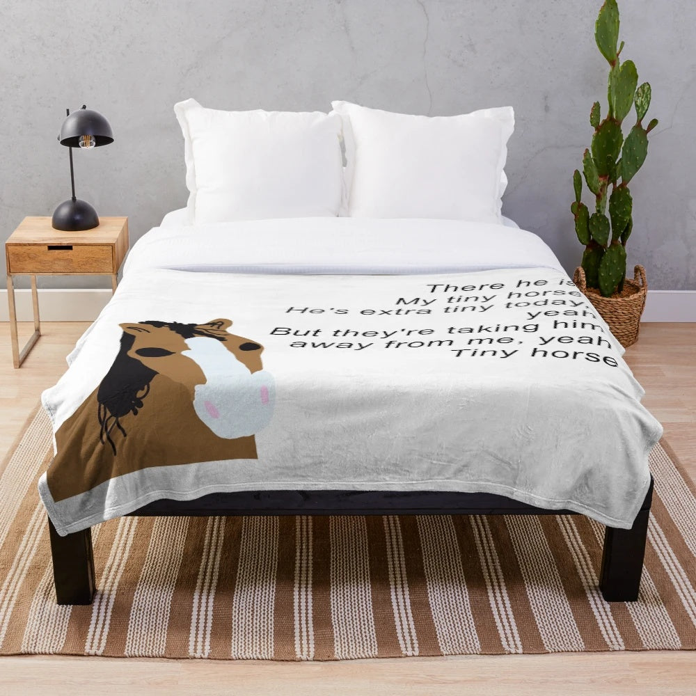 Cozy plush blanket featuring a tiny horse design inspired by Timothee Chalamet's SNL appearance