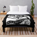 Soft, plush blanket featuring a portrait of singer-songwriter Tom Waits and the title of his album "Crooked Tree