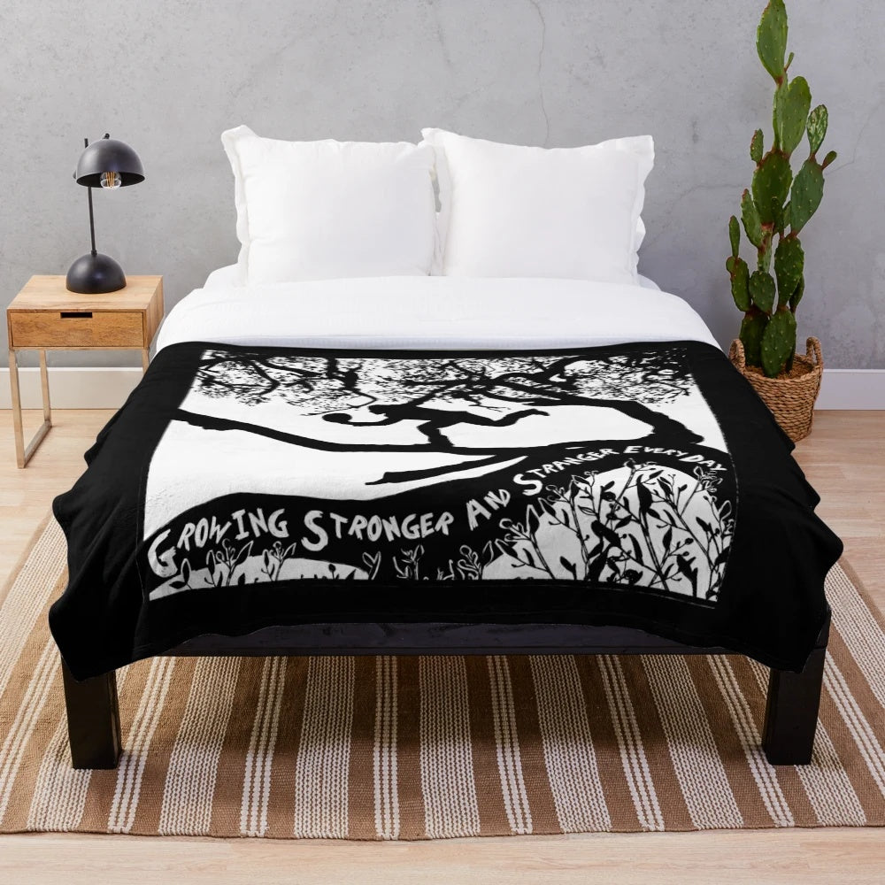 Soft, plush blanket featuring a portrait of singer-songwriter Tom Waits and the title of his album "Crooked Tree