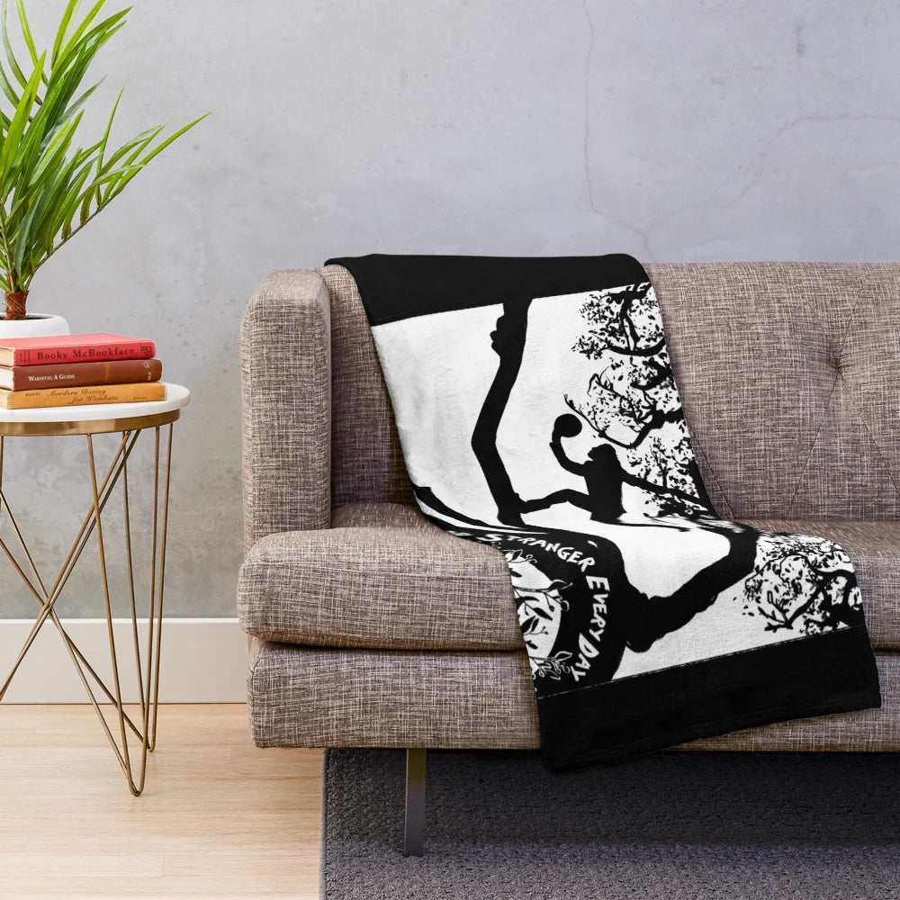 Soft, plush blanket featuring a portrait of singer-songwriter Tom Waits and the title of his album "Crooked Tree