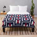 Tractor-inspired plush blanket with farm equipment logos
