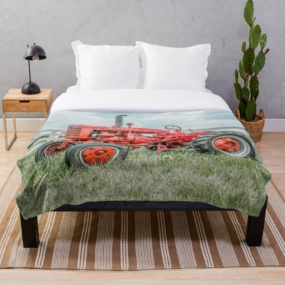 Tractor plush blanket in a rustic, vintage style