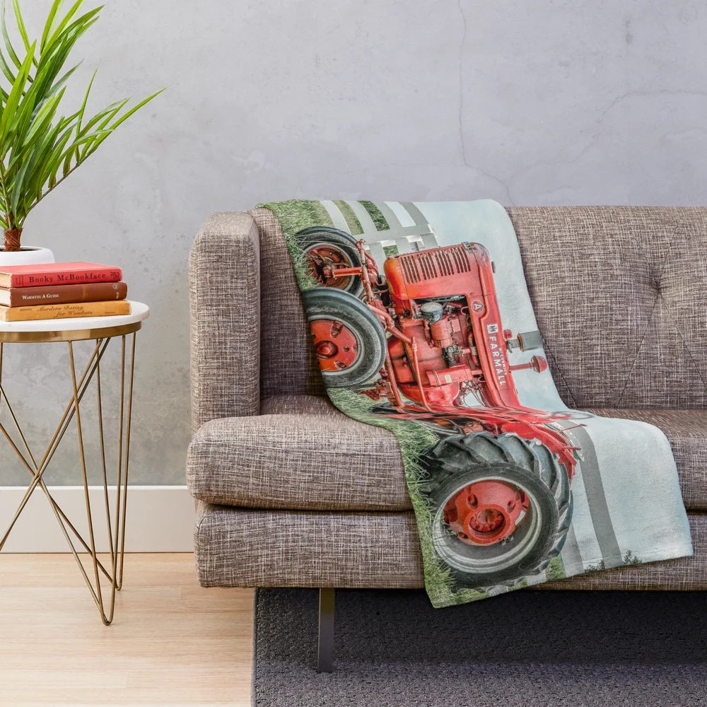 Tractor plush blanket in a rustic, vintage style