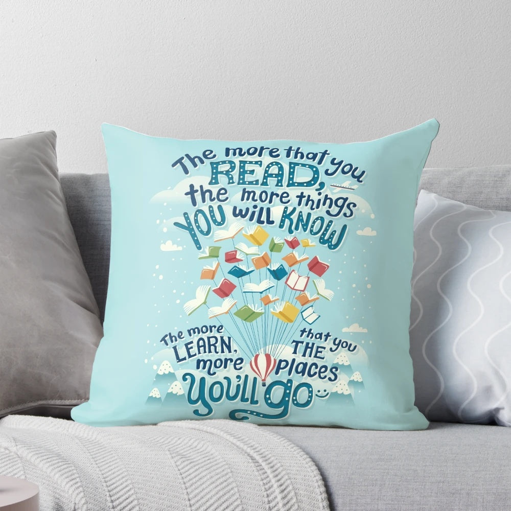 A soft, decorative pillow featuring a whimsical design with hot air balloons, perfect for readers and book enthusiasts.