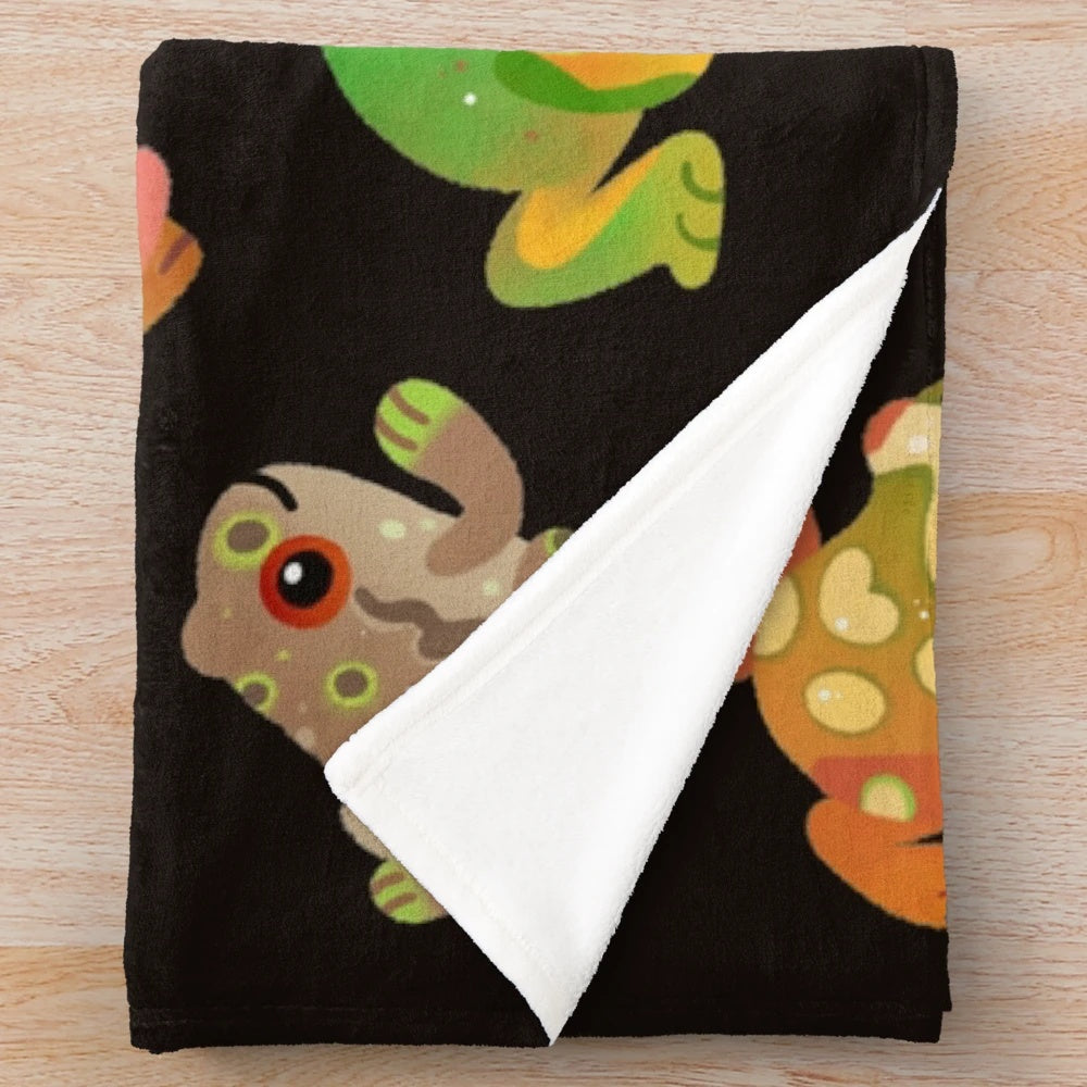 Soft and cuddly plush blanket featuring a detailed tree frog design