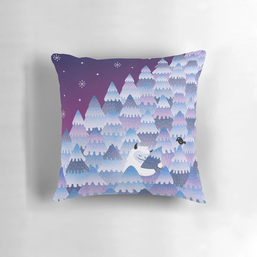 A soft, plush pillow featuring a whimsical "Tree Hugger" night monster design, perfect for cozy winter snuggles.
